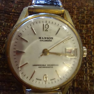 Madson Calendar Automatic Swiss Watch with date ---vintage works great