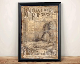 May include: A framed vintage-style print titled Whitechapel Murders or the Mysteries of the East End. The sepia-toned illustration depicts a figure standing over a prone body on a street, with a poster on a wall and a gas lamp in the background.