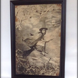 Aged reproduction Victorian print of a young witch flying on a broomstick - A4 size.