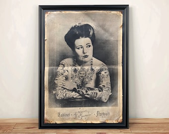 May include: Black and white vintage poster of a woman with tattoos on her arms and chest. The poster is framed in black and has the text "Cabinet -  - Portrait" at the bottom.