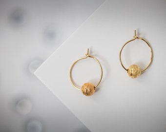 Minimalist gold-colored stainless steel hoop earrings