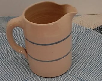 Vintage glazed pottery pitcher cream with blue band