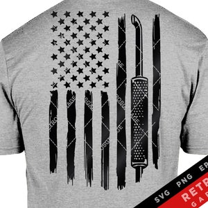 May include: A black and white graphic design of an American flag with a welding tool in the center. The flag is painted in a distressed style. The text "RETR0S GARAGE" is in the bottom right corner of the image. The text "SVG PNG EPS AI" is in the bottom right corner of the image.