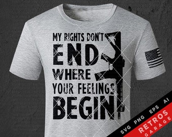 May include: A gray t-shirt with a black graphic design that reads "My Rights Don't End Where Your Feelings Begin". The graphic also includes a silhouette of a rifle. The shirt has a small American flag on the right sleeve. The text "SVG PNG EPS AI RETROS GARAGE" is printed in black on a white background in the lower right corner of the image.