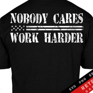 May include: Black t-shirt with white text that reads "Nobody Cares Work Harder" with two American flag stripes above the text.