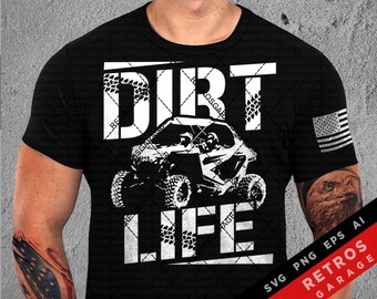 May include: A black t-shirt with a white graphic design of a dirt bike and the text "Dirt Life". The graphic is surrounded by a white border and tire tread patterns. The t-shirt also features a small American flag in the upper right corner.