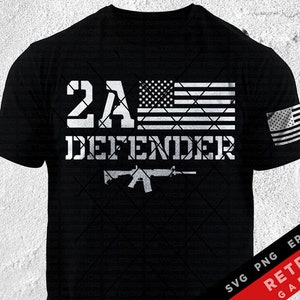 May include: Black t-shirt with a white graphic design featuring the text "2A Defender" with an American flag and a silhouette of a rifle.