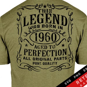 May include: A green t-shirt with a black vintage-style graphic that reads "This Legend Was Born In 1960 Aged To Perfection All Original Parts Pure Quality".