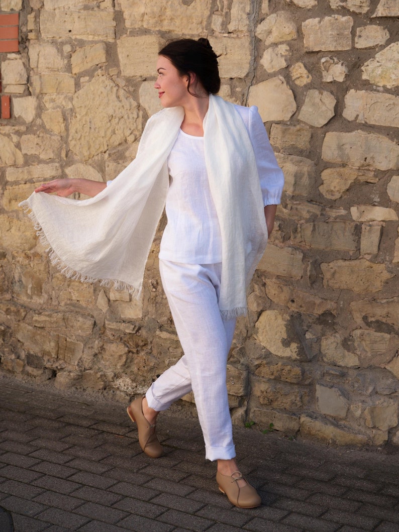 Elegant washed linen shawl in natural tones, a perfect accessory for any outfit.