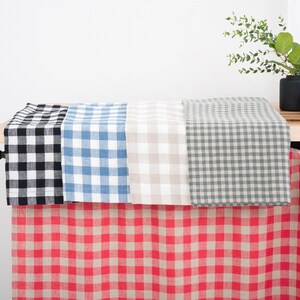 Kitchen cabinet with blue, red, and black gingham linen curtains, showcasing multiple color options for kitchen, bathroom, or cabinet windows, highlighting the natural texture and quality of linen fabric