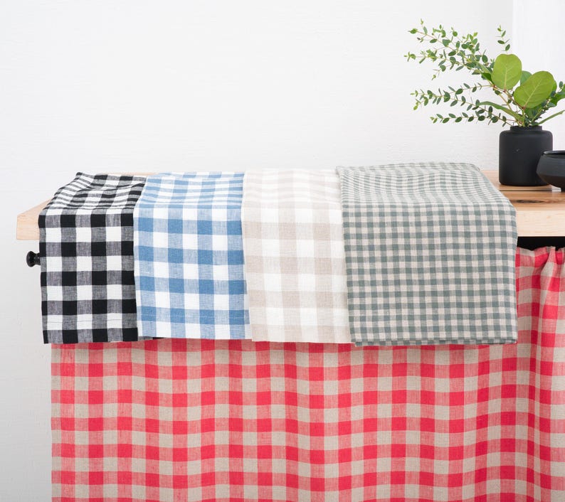Kitchen cabinet with blue, red, and black gingham linen curtains, showcasing multiple color options for kitchen, bathroom, or cabinet windows, highlighting the natural texture and quality of linen fabric