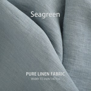 Close-up of seagreen premium organic linen fabric, displaying the fine texture and weave of high-quality European flax material sold by the yard.