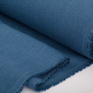 A roll of Denim Blue pure linen fabric