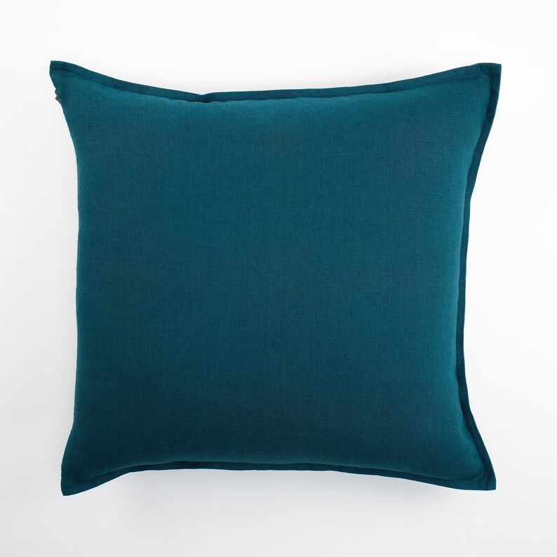 Dark teal linen pillow cover displayed against a white background.