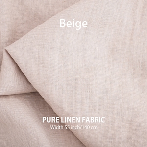 Folded beige organic linen fabric, available by the yard, highlighting the high-quality and premium European weave.