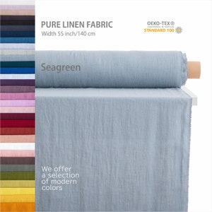 Organic linen fabric roll in seagreen, soft texture, displayed with a range of color options, certified quality, ideal for various crafts and garments.