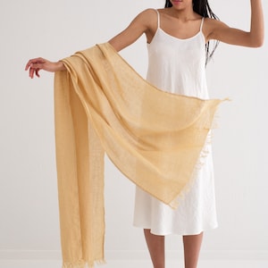 Natural colors and soft washed linen make this linen shawl a versatile accessory for any season.