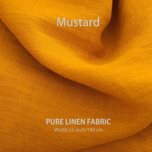 "Close-up of premium mustard pure linen fabric by the yard, showcasing the fine texture and natural color of high-quality European flax textiles, available from a specialized washed linen fabric store."