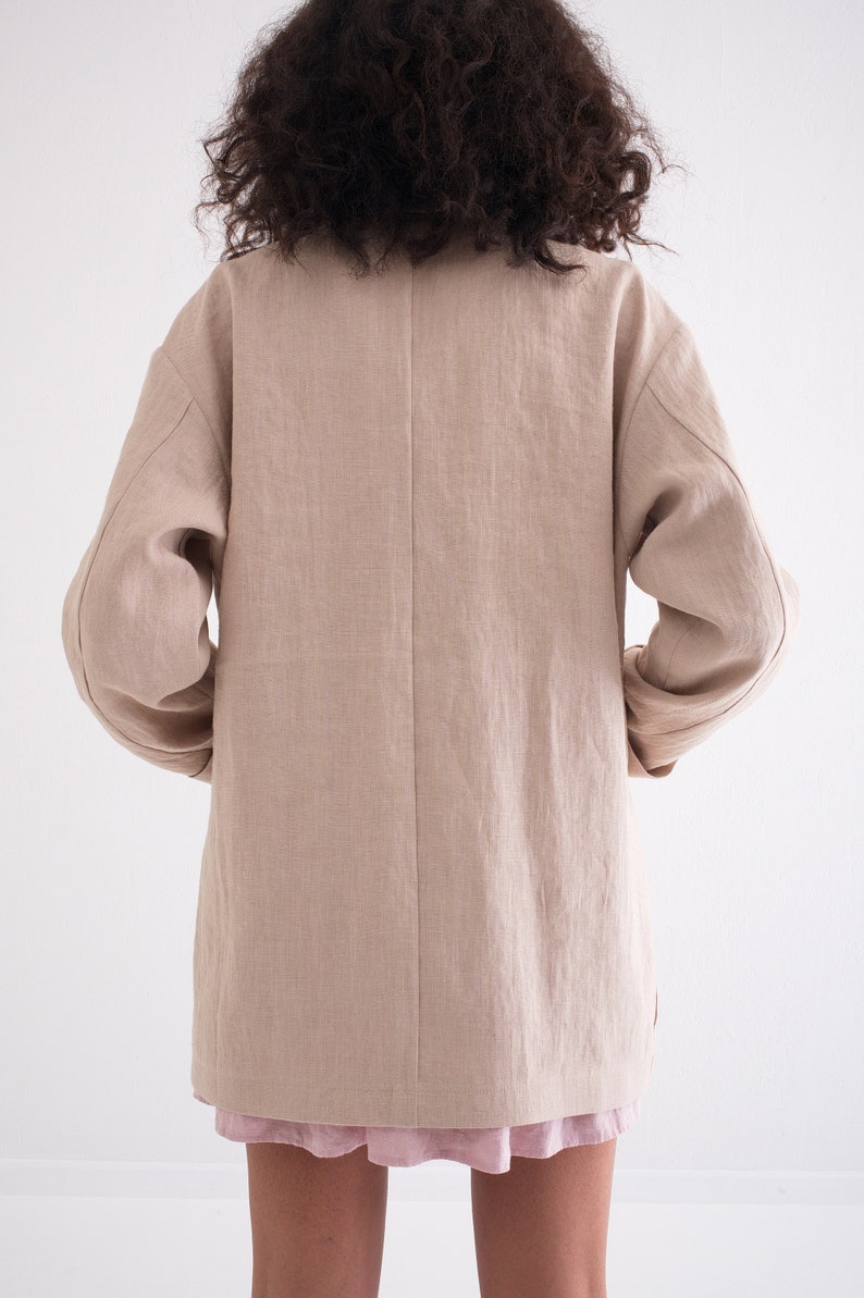 Rear view of a Women's Summer Linen Jacket with Pockets, showcasing the Casual Loose Fit of a Natural Blazer in a light hue.