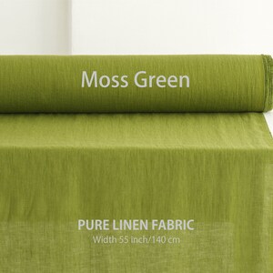 Roll of Moss Green pure linen fabric, premium European quality flax textile, perfect for clothing, available by the yard at a linen fabric store.