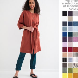 A woman in a terracotta linen maxi coat with pockets, indicative of comfort and style for plus sizes, stands beside a color swatch palette.