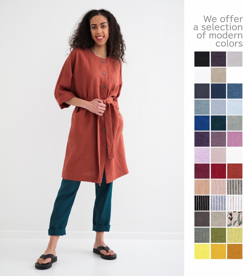 A woman in a terracotta linen maxi coat with pockets, indicative of comfort and style for plus sizes, stands beside a color swatch palette.