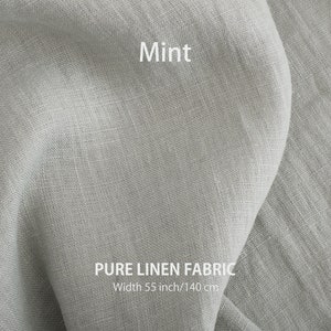 A textured mint green pure linen fabric draped elegantly, with "Mint" and "PURE LINEN FABRIC, Width 55 inch/140 cm" text showcasing its color and size.