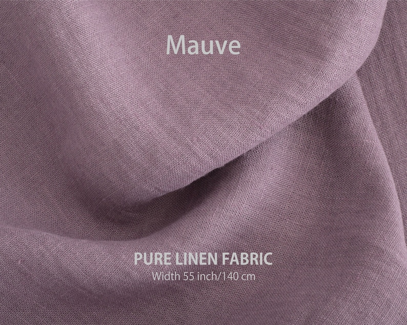 Elegant mauve organic linen fabric draped gracefully, exemplifying premium European quality, sold by the yard.