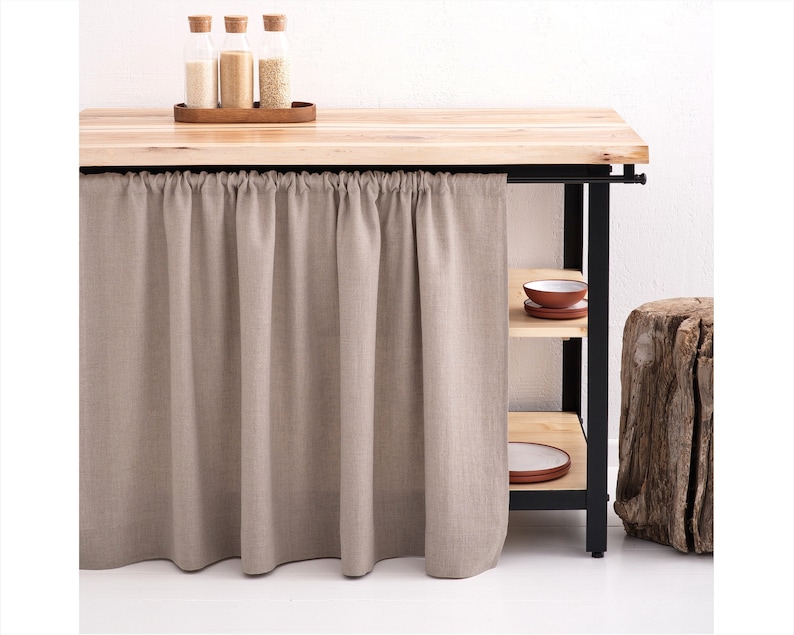 A natural stonewashed linen curtain in taupe, fitted to a kitchen cupboard or bathroom shelf in custom size, certified by OEKO-TEX for eco-friendly decor.