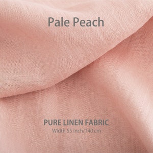 A delicate pale peach pure linen fabric gently folded, highlighting its fine texture, with the label "Pale Peach" and "PURE LINEN FABRIC, Width 55 inch/140 cm".