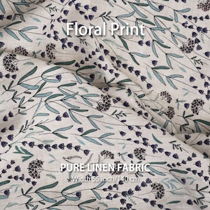 Detailed view of pure linen floral print fabric by the yard from a linen fabric store, featuring premium European quality best flax textiles with a wide-striped design, available for sale.