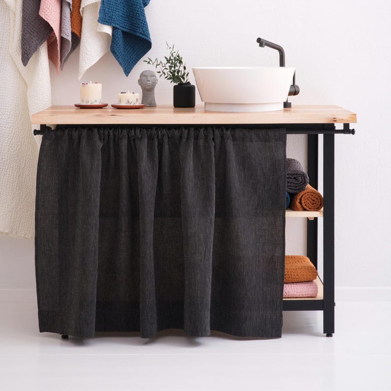 A modern interior with farmhouse kitchen curtains and a selection of custom size window valances and cafe curtains for bathroom in stone washed linen displayed.