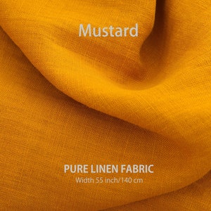 K&ouml;nnte beinhalten: Ein Nahaufnahme von einem senfgelben Leinenstoff. Der Stoff ist gefaltet und hat eine weiche, strukturierte Oberfl&auml;che. Der Text "PURE LINEN FABRIC" und "Width 55 inch/140 cm" ist auf den Stoff gedruckt.