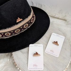 May include: Two small wooden mountain-shaped pins on white cards with the text "Handmade by TERESA LOVES CRAFTS" and "TeresaLovesCrafts.etsy.com".
