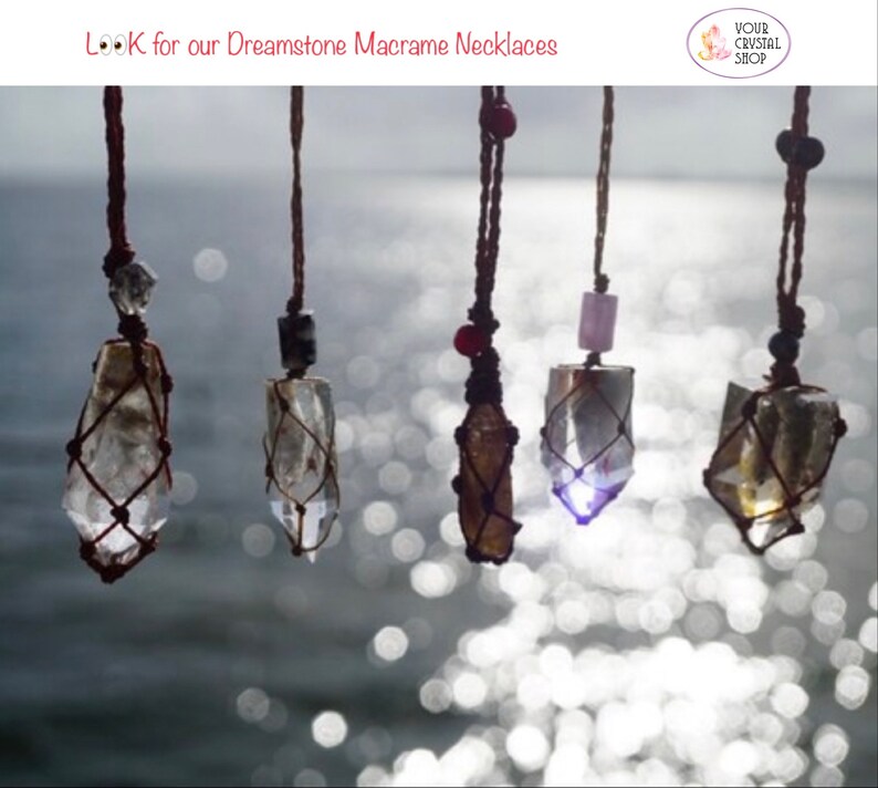 May include: Five crystal necklaces with macrame string, hanging against a blurred background of water and sunlight. The crystals are clear, brown, and purple. The text "LOOK for our Dreamstone Macrame Necklaces" is at the top of the image.