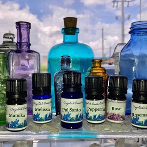 Pure Essential Oils: Manuka, Melissa, Orange, Oregano, Patchouli, Peppermint, Palo Santo, Ravensara, Rosemary, Rose   w/ Charged Crystal