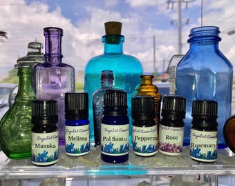 Oli essenziali puri: Manuka, Melissa, Arancia, Origano, Patchouli, Menta piperita, Palo Santo, Ravensara, Rosmarino, Rosa con Cristallo Caricato