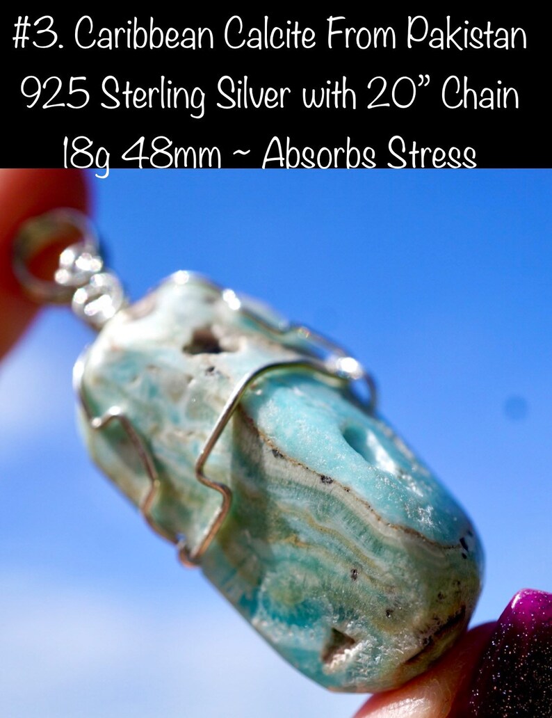 May include: A Caribbean Calcite pendant from Pakistan, wrapped in 925 sterling silver with a 20 inch chain. The pendant is light blue and green with white streaks and measures 18 grams and 48 millimeters. The text "#3. Caribbean Calcite From Pakistan 925 Sterling Silver with 20" Chain 18g 48mm ~ Absorbs Stress" is visible in the image.