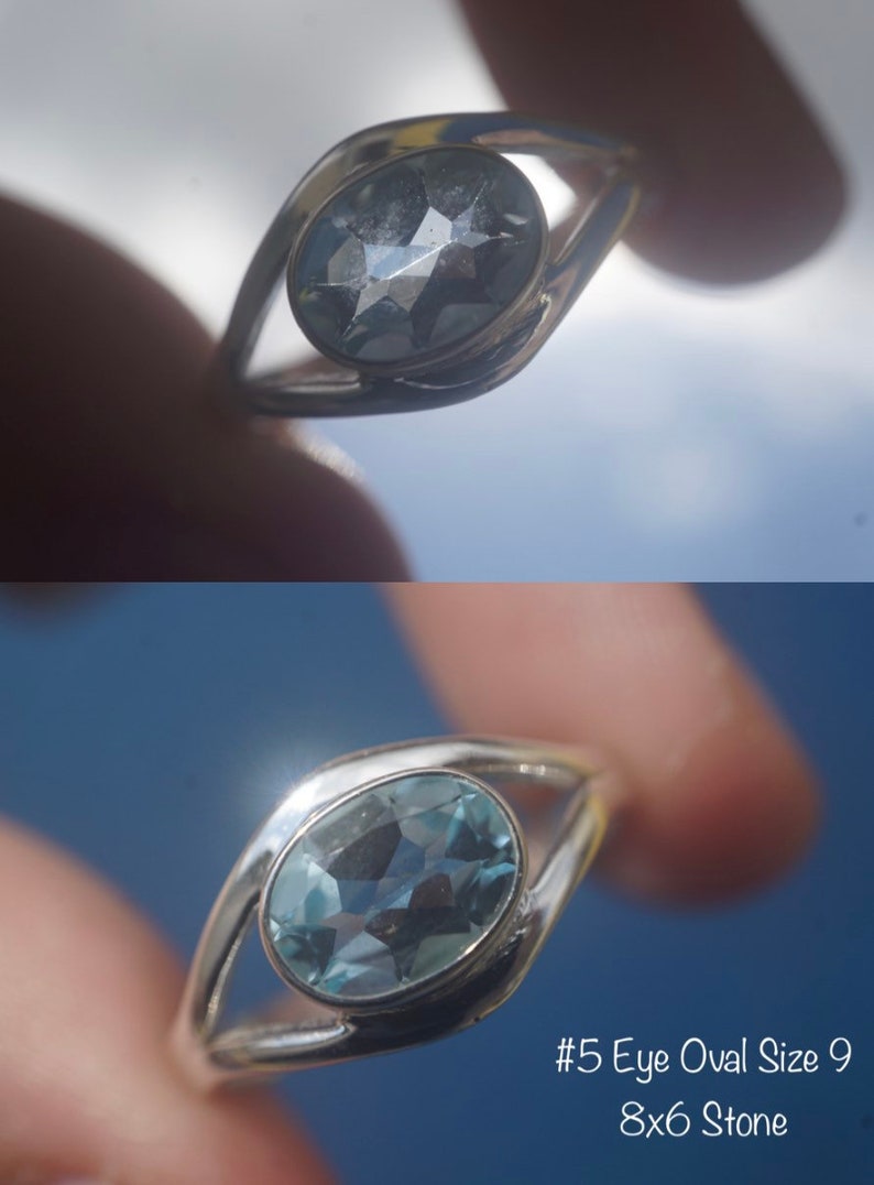 May include: Silver ring with a light blue oval gemstone. The ring is designed in an eye shape. The stone is 8x6 mm. #5 Eye Oval Size 9 8x6 Stone
