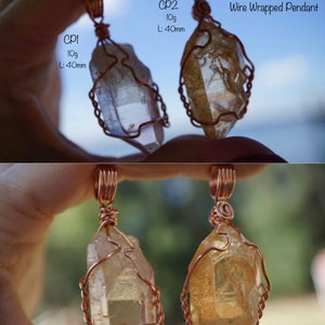 May include: Two wire-wrapped pendants featuring natural tangerine quartz crystals. The crystals are a light golden colour and are wrapped in copper wire. The pendants are labelled "CP1" and "CP2" and are each 40mm long and weigh 10 grams.  "Natural Tangerine Quartz Solid Copper Wire Wrapped Pendant"