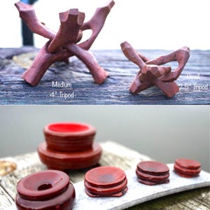 May include: Set of five wooden display stands for crystals and other small objects. The stands are made of dark wood and have a glossy finish. The stands are available in two sizes: 2.5 inches and 4 inches. The stands are perfect for displaying crystals, stones, or other small objects.