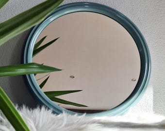 Space Age round mirror in turquoise by Tiger plastics