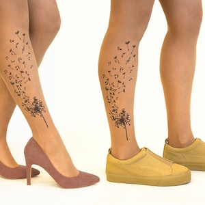 May include: Two pairs of nude tights with a black dandelion design featuring musical notes. One pair is worn with brown heeled shoes, the other with tan sneakers.