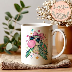 A white mug with a colorful turtle design and a pink bubble gum bubble on it, placed on a beige cloth.