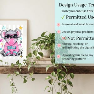 a framed illustration of a koala wearing sunglasses, placed on a shelf next to a potted plant.