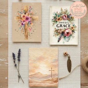 three different artworks or cards, each with a unique design and color scheme. The top card features a cross with a floral arrangement, the middle card has a floral design, and the bottom card has a landscape scene with a cross. There are also some dried lavender flowers and a feather pendant on the table.