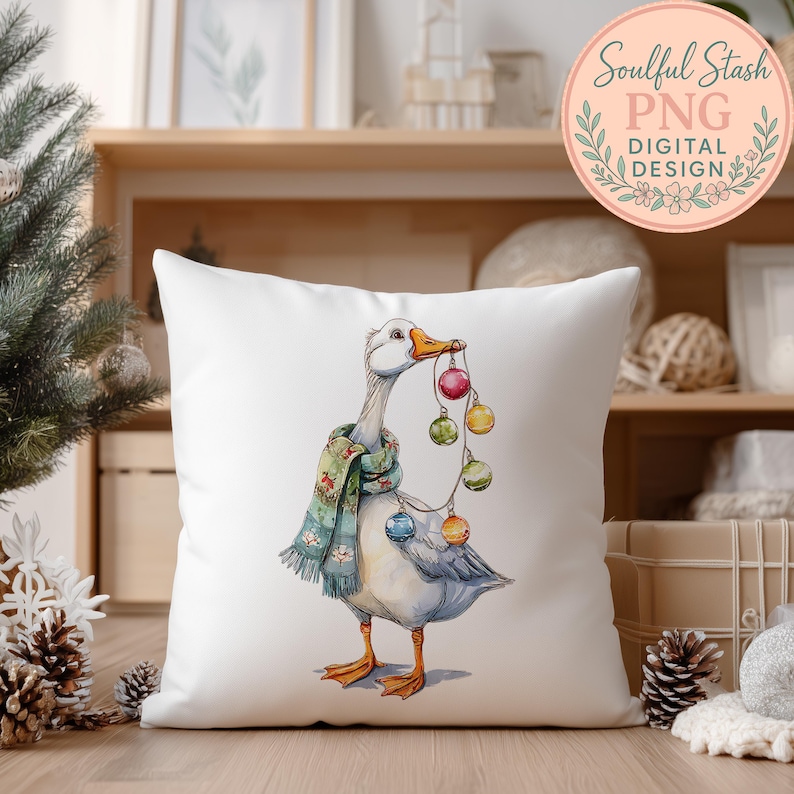 A white pillow with a colorful illustration of a duck holding Christmas ornaments.