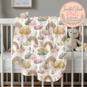 a baby crib with a blanket with a rainbow and clouds on it