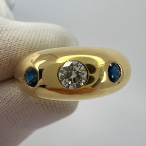 Cartier Diamond And Blue Sapphire 18k Yellow Gold Three Stone Dome Daphne Ring