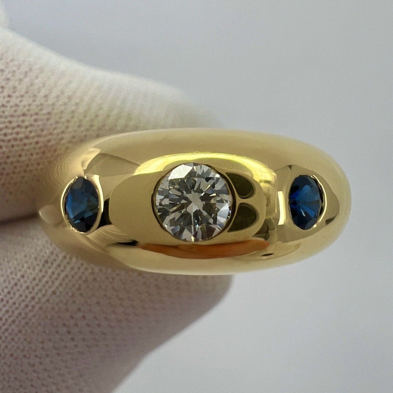Cartier Diamond And Blue Sapphire 18k Yellow Gold Three Stone Dome Daphne Ring